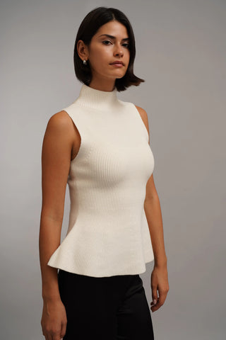 The Sculpted Peplum Turtleneck