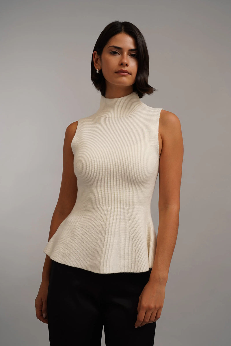 The Sculpted Peplum Turtleneck