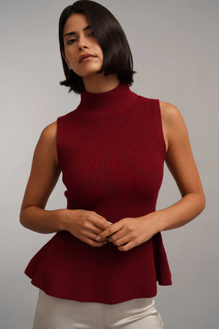 The Sculpted Peplum Turtleneck