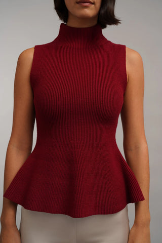 The Sculpted Peplum Turtleneck