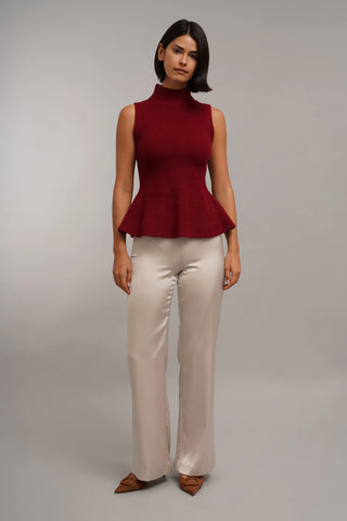 The Sculpted Peplum Turtleneck