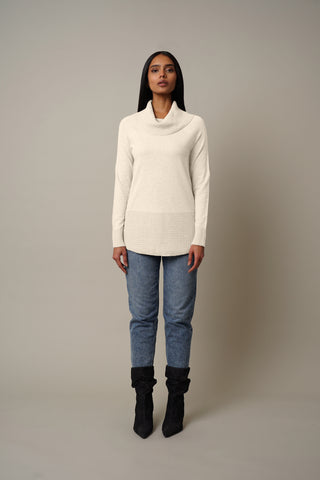 Model is wearing the Waffled Cowl Neck Pullover in Cream.