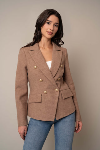 Model is wearing the Blazer With Pockets in Tan.