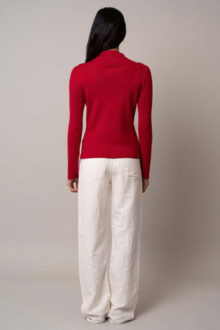 Model is wearing the long-sleeve-funnel-neck-pullover in Venetian Red