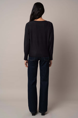 Model is wearing the long-sleeve-dolman-sweater in Black