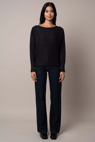 Model is wearing the long-sleeve-dolman-sweater in Black