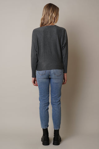 Model is wearing the long-sleeve-dolman-sweater in Charcoal Heather