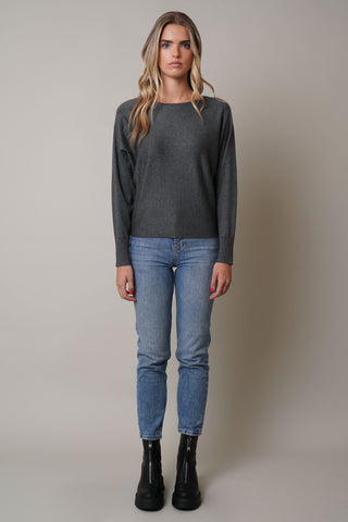 Model is wearing the long-sleeve-dolman-sweater in Charcoal Heather