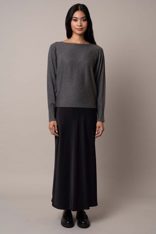 Model is wearing the long-sleeve-dolman-sweater in Charcoal Heather