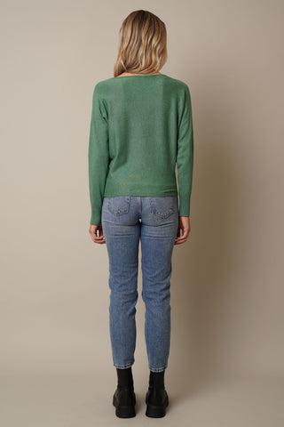 Model is wearing the long-sleeve-dolman-sweater in Forest Heather Green