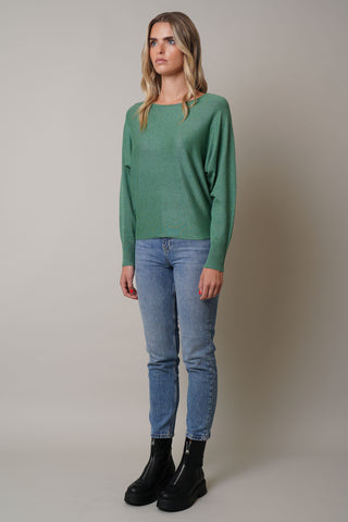 Model is wearing the long-sleeve-dolman-sweater in Forest Heather Green