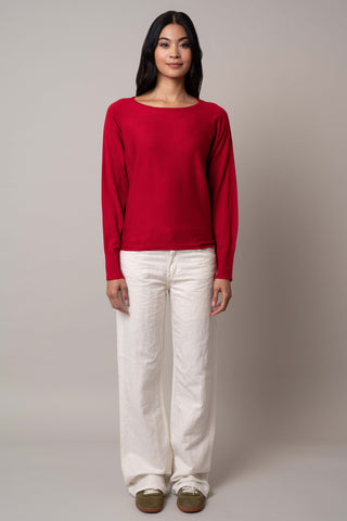 Model is wearing the long-sleeve-dolman-sweater in Venetian Red