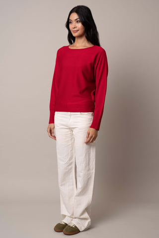 Model is wearing the long-sleeve-dolman-sweater in Venetian Red