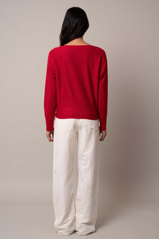 Model is wearing the long-sleeve-dolman-sweater in Venetian Red