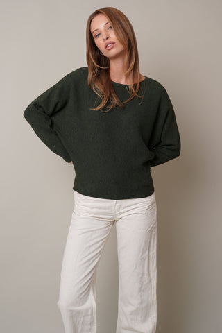 Model is wearing the dolman-boat-neck-sweater in Burnt Olive Heather