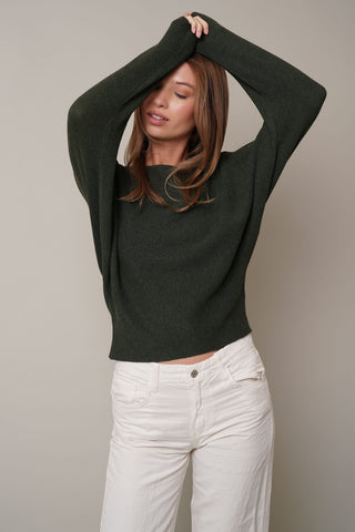 Model is wearing the dolman-boat-neck-sweater in Burnt Olive Heather