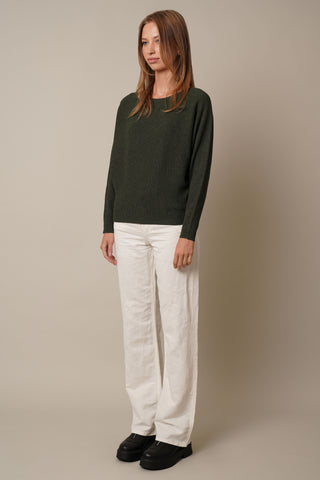 Model is wearing the dolman-boat-neck-sweater in Burnt Olive Heather