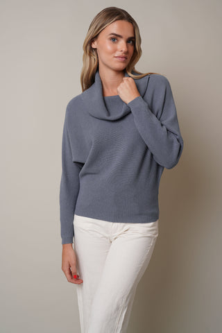 Model is wearing the Cowl Neck Dropped Sleeve Sweaterby Cyrus in Static