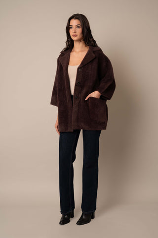 Model is wearing the 3/4 Sleeve Mink Coat in Deep Mahogany.