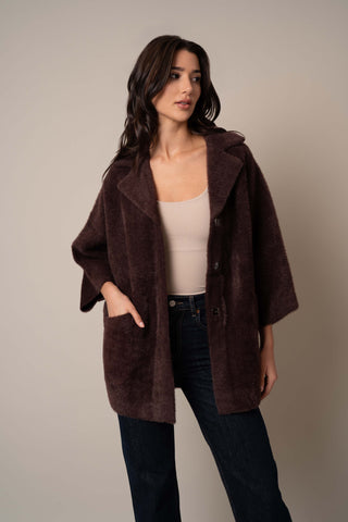 Model is wearing the 3/4 Sleeve Mink Coat in Deep Mahogany.