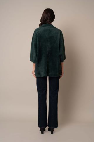 Model is wearing the 3/4 Sleeve Mink Coat in Scarab Green.