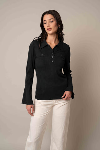 Model is wearing the Flared Sleeve Button-Up in Black.