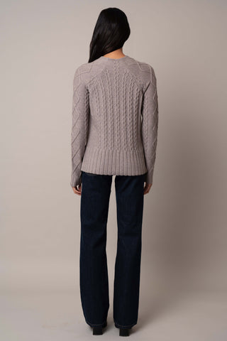 Model is wearing the cable-funnel-neck-pullover in Cinder