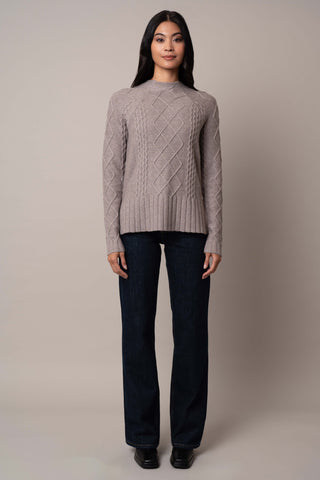 Model is wearing the cable-funnel-neck-pullover in Cinder