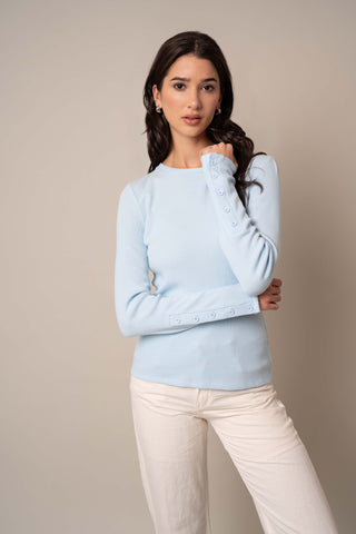 Model is wearing the Waffle Long Sleeve Crew Neck Top in Delicate Blue.