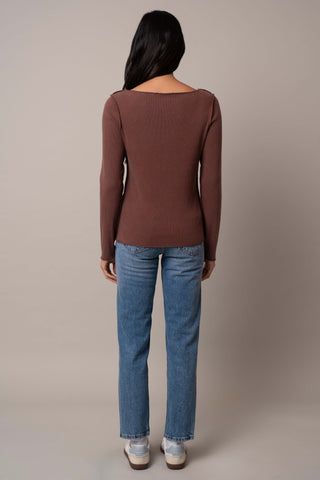 Model is wearing the Long Sleeve Boat Neck Shirt in Clay.