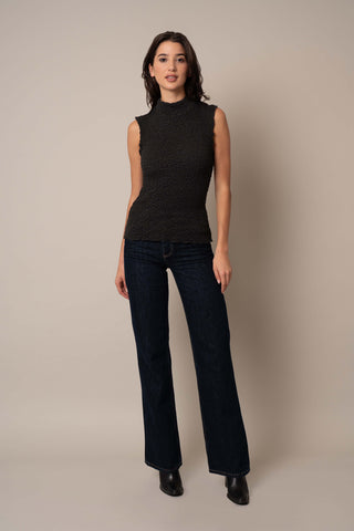 Model is wearing the Sleeveless Crinkle Top in Black.