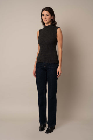 Model is wearing the Sleeveless Crinkle Top in Black.