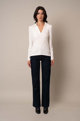 Model is wearing the Ribbed Long Sleeve Shirt With Collar in Bone.