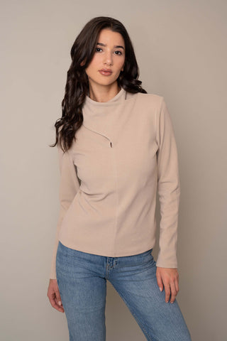 Model is wearing the Knit Wrap Neck Top in Almond.