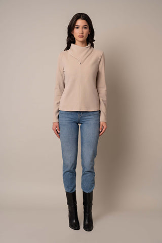 Model is wearing the Knit Wrap Neck Top in Almond.