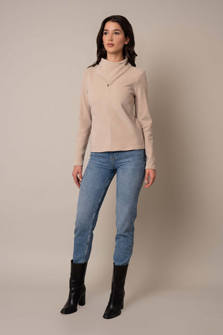 Model is wearing the Knit Wrap Neck Top in Almond.